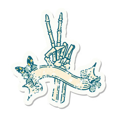 Fototapeta premium grunge sticker with banner of a skeleton hand giving a peace sign