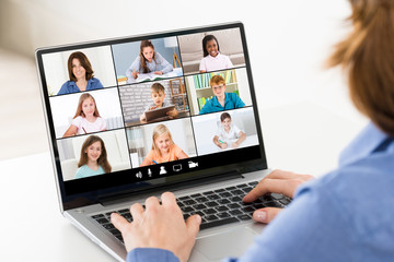Fototapeta na wymiar Woman Video Chatting On Laptop