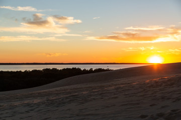 Fototapeta na wymiar Sunset Over the Sound with Dunes and Wild Shrubs at Corolla, North Carolina