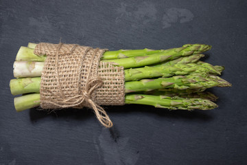 Fresh tasty green asparagus in rustic style
