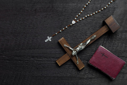 Christian Cross On Wood Bible And Rosary Beads Over Wooden Vintage Background