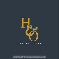 Initial letter H & O HO luxury art vector mark logo, gold color on black background.