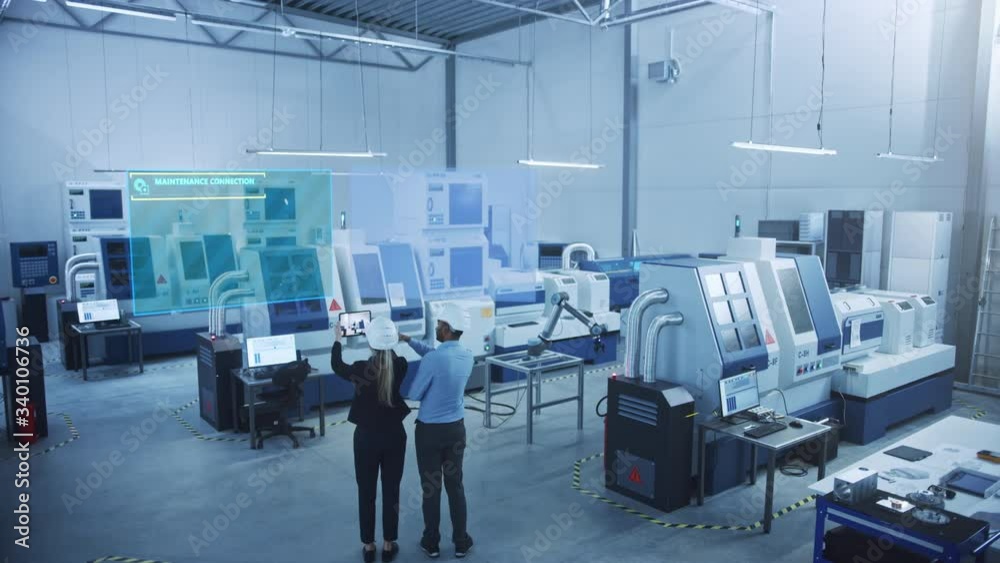 Poster Industry 4.0 Factory: Two Engineers Uses Digital Tablet Computer with AR Software to Connect with High-Tech CNC Machinery, Robot Arm and Visualize Maintenance and Diagnostics of the Equipment