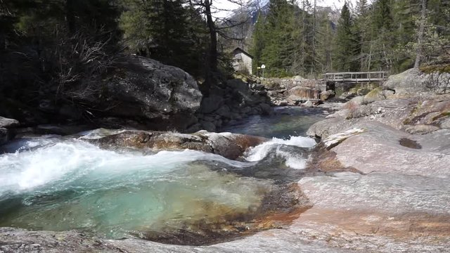 Mountain alpine river with rocks and splashes. View of the river in Macugnaga, near Monte Rosa Alps.