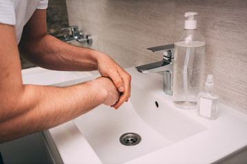 Washing hands rubbing with soap man for corona virus prevention, hygiene to stop spreading coronavirus.sanitiser, covid 19