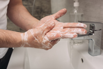 Washing hands rubbing with soap man for corona virus prevention, hygiene to stop spreading coronavirus.sanitiser, covid 19