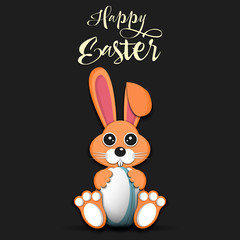 Rabbit with easter egg decorated in the form of a rugby ball