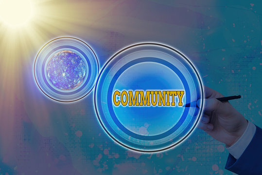 Text sign showing Community. Business photo text group of showing with a common characteristics living together Elements of this image furnished by NASA