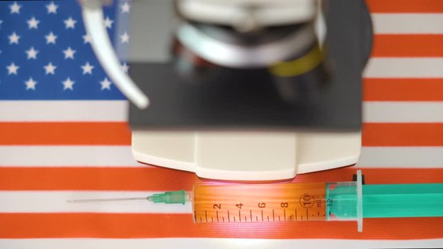 A 10ml fluid in the syringe on the USA flag