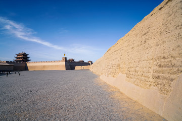 The majestic Jiayuguan City watchtower in Gansu Province, China. Chinese characters on black plaque: Jiayuguan.The majestic Jiayuguan Great Wall Corner Tower in Gansu , China.The turret of the wall © Liu Lei