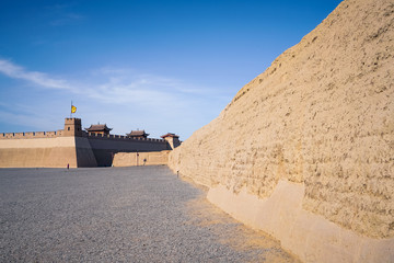 The majestic Jiayuguan City watchtower in Gansu Province, China. Chinese characters on black plaque: Jiayuguan.The majestic Jiayuguan Great Wall Corner Tower in Gansu , China.The turret of the wall © Liu Lei
