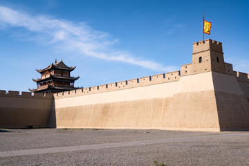 The majestic Jiayuguan City watchtower in Gansu Province, China. Chinese characters on black plaque: Jiayuguan.The majestic Jiayuguan Great Wall Corner Tower in Gansu , China.The turret of the wall © Liu Lei