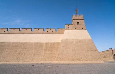 The majestic Jiayuguan City watchtower in Gansu Province, China. Chinese characters on black plaque: Jiayuguan.The majestic Jiayuguan Great Wall Corner Tower in Gansu , China.The turret of the wall © Liu Lei