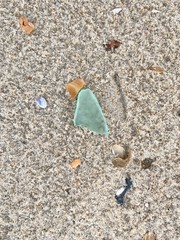 Sea glass in sand, mermaid tear