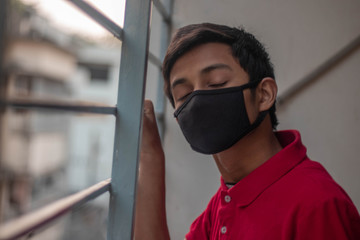 Chiness boy wearing medical mask at school premises to prevent infection from Corona virus in Wuhan China,Influenza virus.Wuhan school is started again after lock down.Selective focus