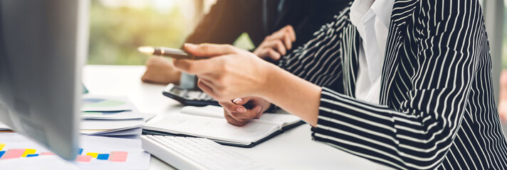 Successful of two casual business discussing and working with laptop computer.creative business people planning and brainstorm in modern office.Teamwork concept