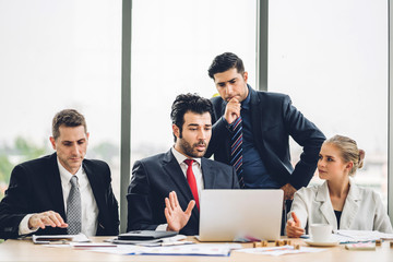 Group of professional business meeting and discussing strategy with new startup project.Creative business people planning and brainstorm with laptop computer in modern office.Teamwork concept