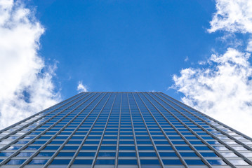 Fototapeta na wymiar Building with square pattern under blue sky