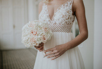 Beautiful bride with bridal bouquet in hand