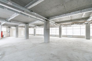 empty pure commercial office building undecorated in gray colors.open space office