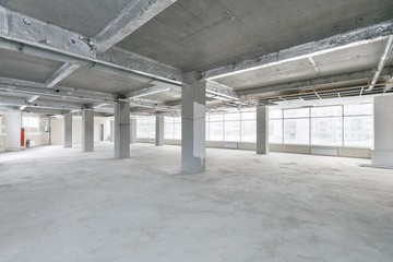 empty pure commercial office building undecorated in gray colors.open space office