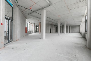 empty pure commercial office building undecorated in gray colors.open space office