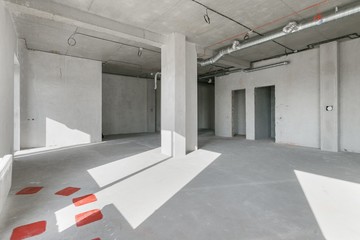 empty pure commercial office building undecorated in gray colors.open space office