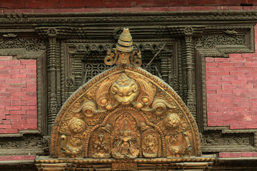 Carving of different hindu gods just above the entrance door in Patan Duurbar Square, World...