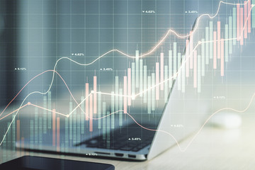 Double exposure of abstract creative financial chart on modern laptop background, research and strategy concept