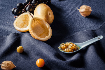 Passion fruit still life on a handmade blue background. Gastronomy concept, fruit, art, colorful