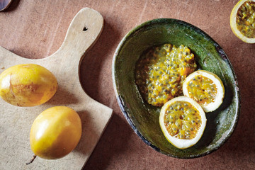 Passion fruit still life on a wooden background. Healthy, organic food concept