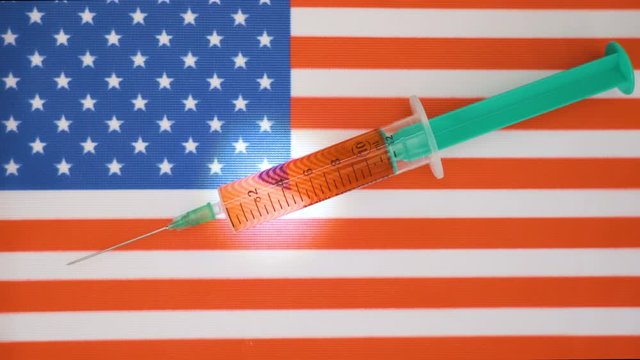 The 10ml fluids inside the small syringe on the USA flag