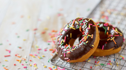A donut on a white wooden table