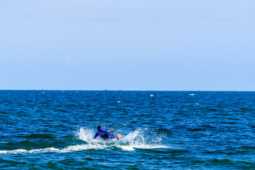 Obraz premium Aerial view of Kitesurfing on the waves of the sea in Mui Ne beach, Phan Thiet, Binh Thuan, Vietnam. Kitesurfing, Kiteboarding action photos