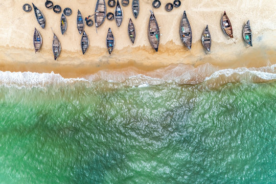 Top view or aerial view of white beach with long tail boats of fisherman in summer of tropical in Vinh Thanh, Hue, Vietnam.