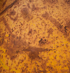 Textured Rust and orange Colored Metal Scratched up and Old  Peeling Paint on metal Bin