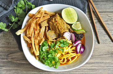 Chiang Mai Curried noodle soup with Pork spare ribs (Thai name is Khao Soi or Khao Sawy).Northern Thai food menu.