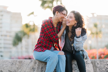 Two Woman Friends Share Secrets