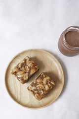 Toffee cake, Homemade cake chocolate with cashews nut caramel  serve with ice chocolate drink, Top view