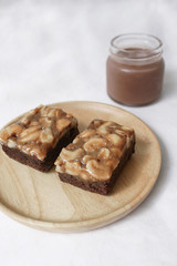 Toffee cake, cashews nut with caramel and chocolate cake serve with ice chocolate drink  