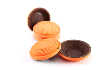 Orange cymbals for trap shooting on white background