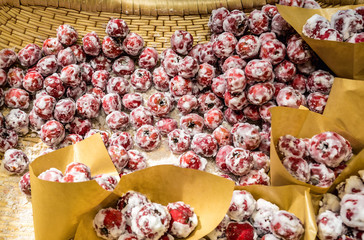 Sugared hawthorns for sale on a indoor food market in Qianmen commercial area of Beijing city in China