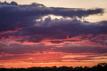 Dramatic red sky during sunset in rural area of Masovia Province in Poland