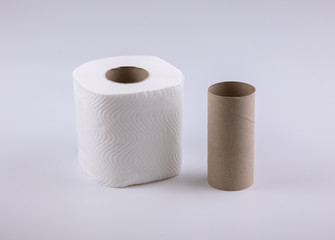 Photo of tissue rolls, before and after use which the core is made of paper brown cardboard and it is ready to recycle, show  concept of changing, such as, diet for fat and thin, or young and old.