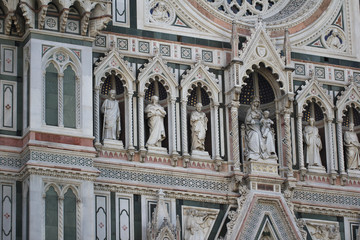 The marvellous human statue decorated on Florance duomo, The mistery sculpture on Famous white Architectural cathedral church under blue sky at Florance, The largest church in Italy, travel destinatio