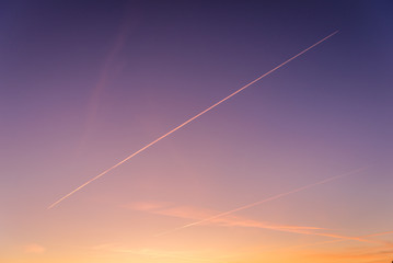 Contrails seen during sunset over Warsaw city in Poland
