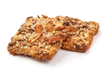 Cookies with nuts and seeds of peanut, sunflower seeds, sesame, linen, organic food, isolated on white background