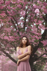 Woman at Blossoming Sakura Tree on Nature