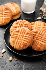 Homemade peanut butter cookies on black background