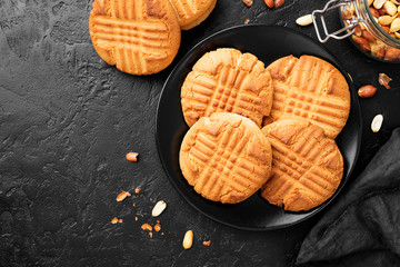 Homemade peanut butter cookies on black background